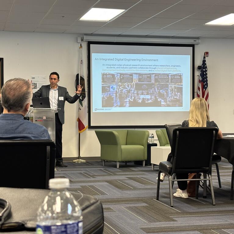Kavan Hazeli presents the UCR Advanced & Integrated Manufacturing Hub to manufacturing and industry leaders at the MCIE annual meeting.
